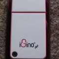 iGino One on top of a Samsung Galaxy S3 phone for size comparison