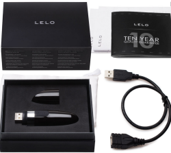 Lelo Mia 2 shown in the packaging and with all included items. The cap is shown removed from the body; a short USB charging cable is pictured as well. 