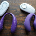 We-Vibe 3 compared to We-Vibe 4. We-Vibe 3's remote had one button, We-Vibe 4's has 4 in a circle. The We-Vibe 3 is shown in a U shape with glossy silicone covered in dust, fur and other crap. The We-Vibe 4 is a much tighter U shape, shown to be relatively free of dust and fur. 