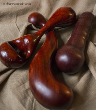 A trio of wood sex toys