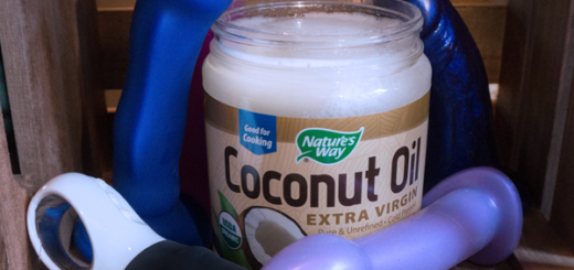 Coconut Oil and Silicone Sex Toys - A jar of coconut oil is surrounded by various silicone sex toys